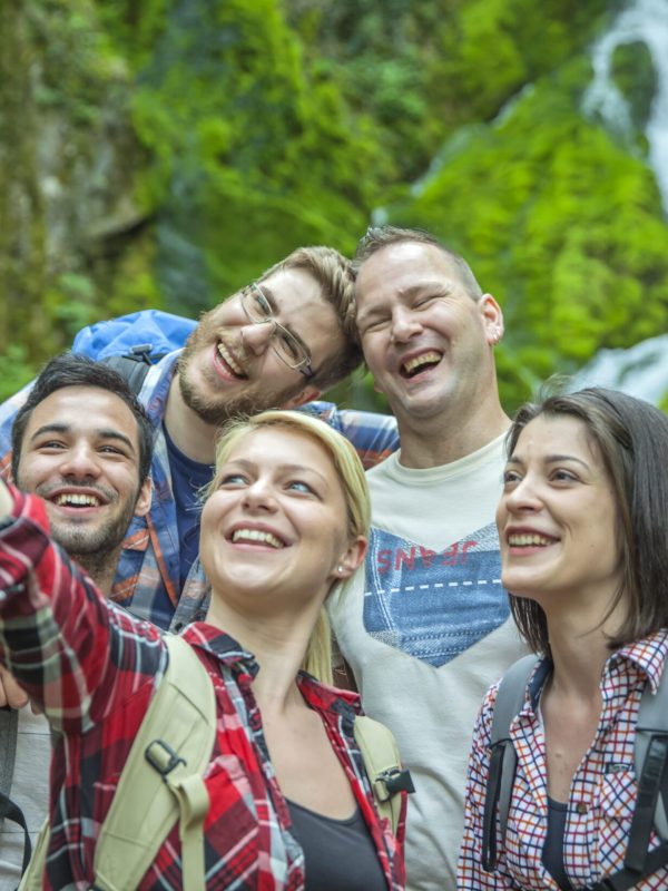 group-friends-having-fun-taking-selfies-nature (1)